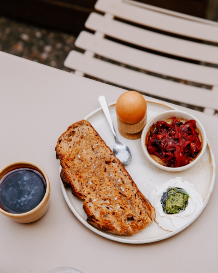 6-minute egg, whipped homemade cottage cheese, wild garlic pesto, nuts, mountain cheese, fermented vegetables, toast, maldon salt