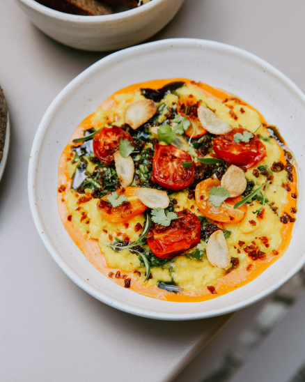Scrambled eggs, balkan cheese, pickled green pepper, walnut butter, fermented wild garlic capers in honey, bread