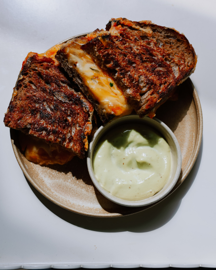 Grilled cheese sandwich, mature cheese, herb kimchi with quince, parsley mayonnaise with garlic