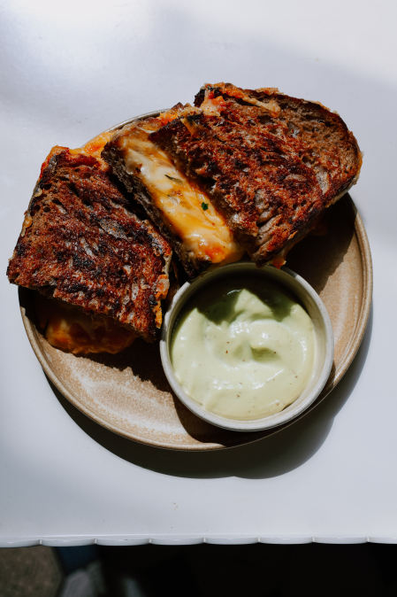 Grilled cheese sandwich, mature cheese, herb kimchi with quince, parsley mayonnaise with garlic